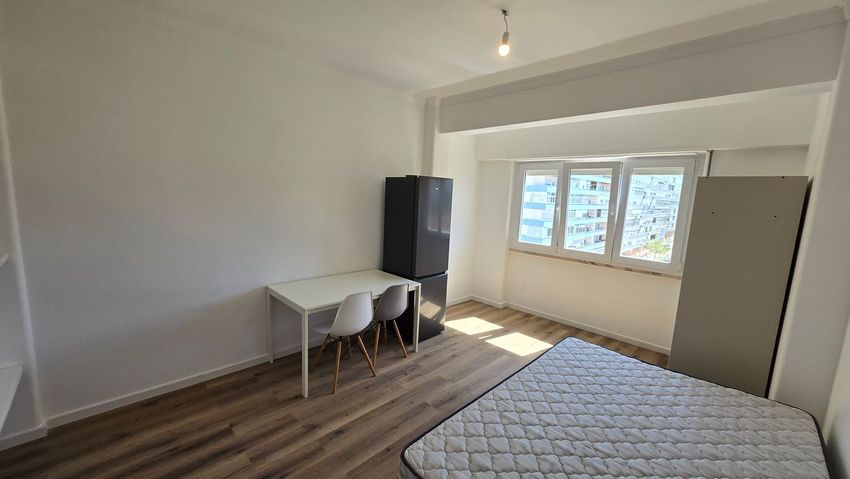Imagem Sala de estar de quarto em Bairro de Santa Cruz