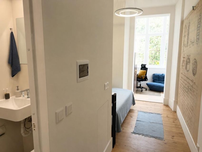 Imagem Sala de estar de quarto em Rua Maria da Fonte